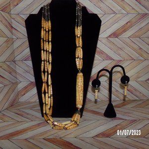 Handmade Asymmetrical carved bone tribal necklace w/ matching carved earrings.